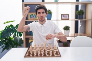 image of a man playing chess board