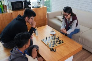image of people playing real chess
